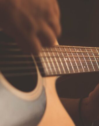 A person playing the guitar