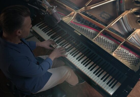 Gary Barlow plays the piano