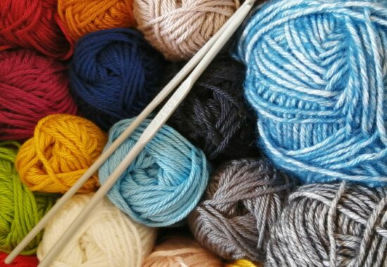 Colourful wool and knitting needles