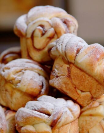Babka buns piled on a plate