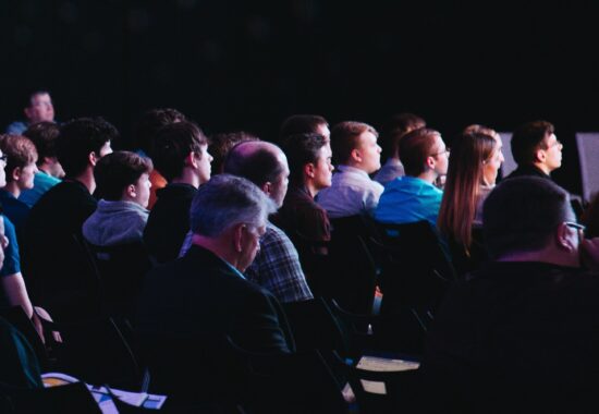 people seated at a business conference