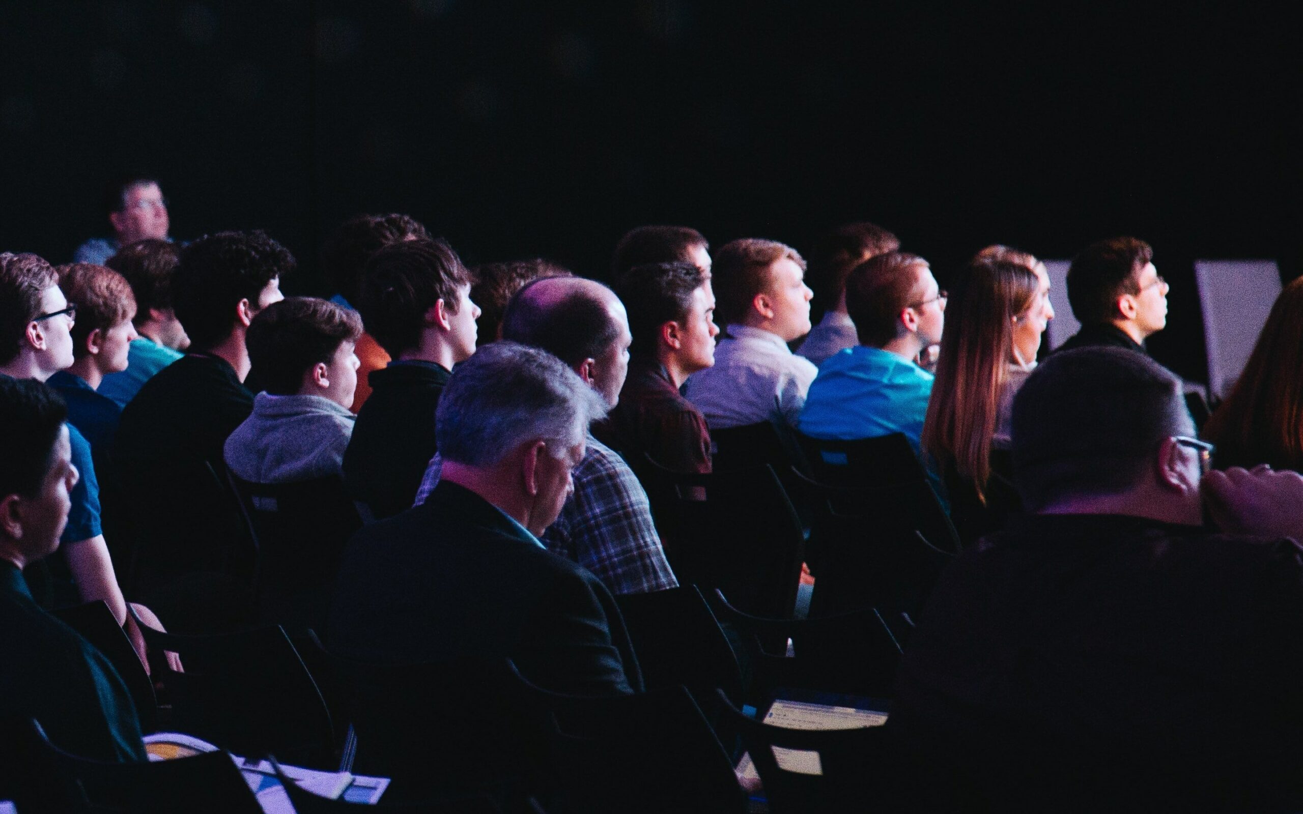 people seated at a business conference