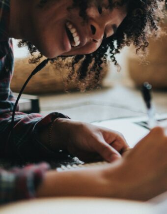 woman writing on paper