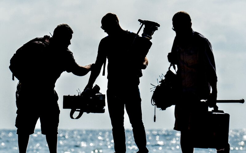 A crew film on a beach