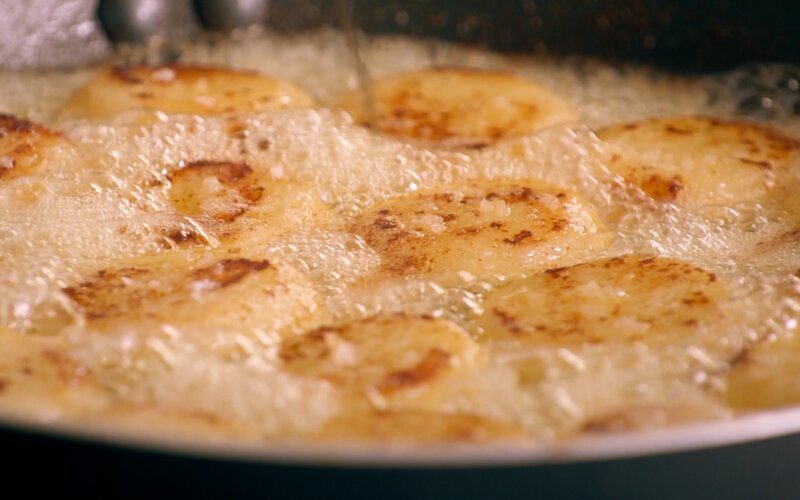 Fondant potatoes simmer in butter