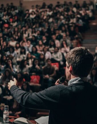 performer on stage with large audience