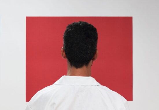 A persons stares at a blank wall